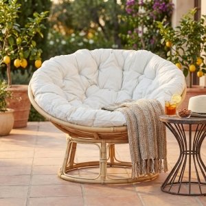 Poltrona rotonda in fibra naturale intrecciata con cuscini beige - FALIVEN Poltrona rotonda in fibra naturale intrecciata con cuscini beige - FALIVEN